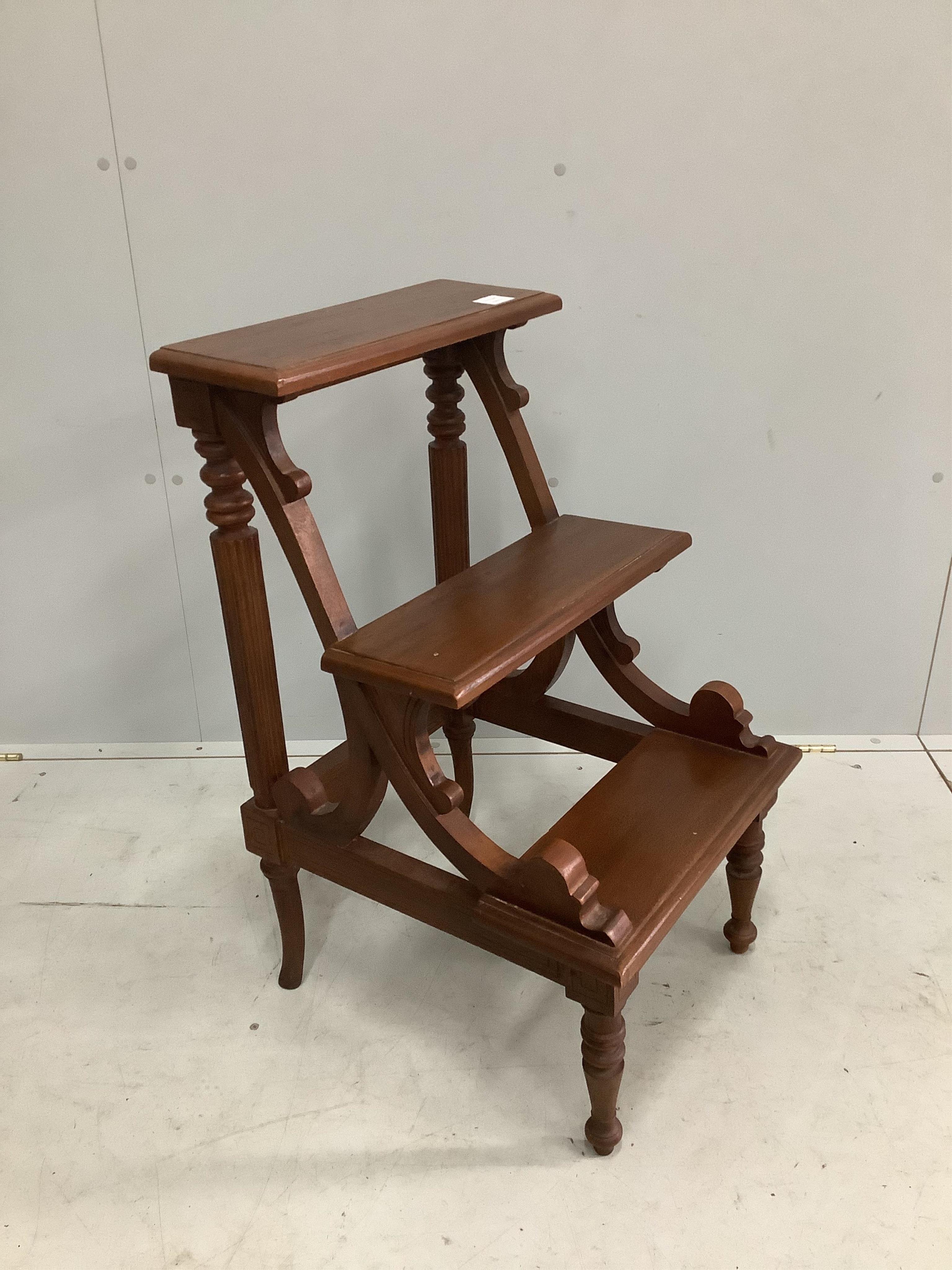 A set of reproduction mahogany three tread library steps, width 46cm, height 82cm. Condition - fair